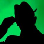 a mysterious shadow of a man with a hat