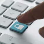 a finger about to press a lock button