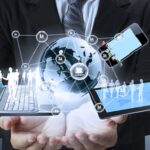 computers and data emerging from open hands